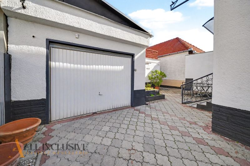 A family house in Trstice with paving and a garage, suitable for safe parking.