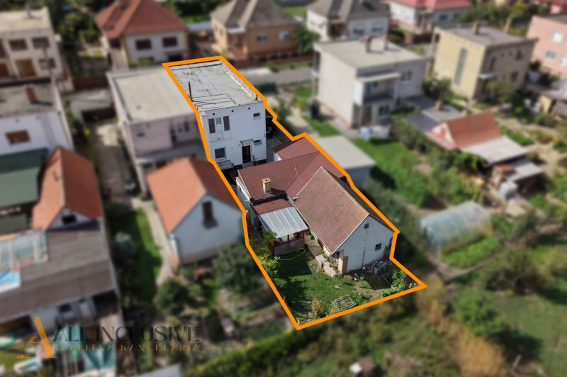 Family house in Trstice, yard and surrounding buildings in a built-up urban area.