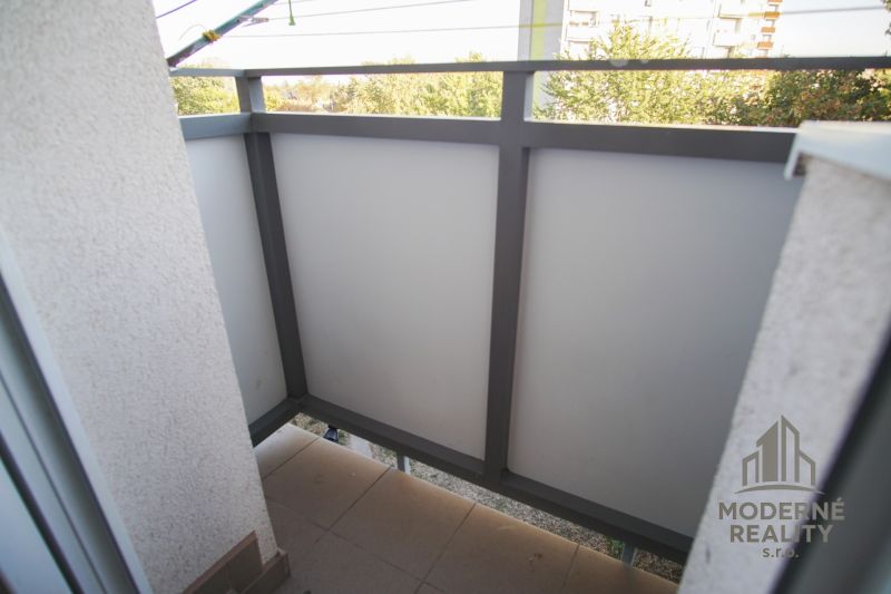A balcony in a 2-room apartment with a view of greenery in Nové Zámky.