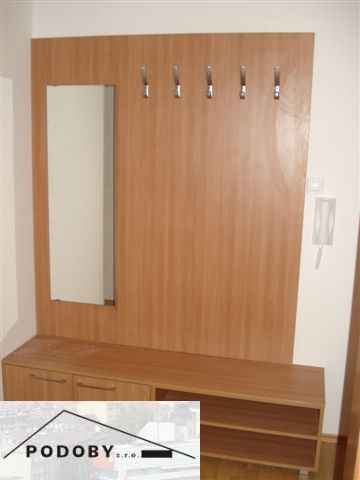 Hallway with coat hooks and a mirror, floor with wooden decor, in a 3-room apartment.