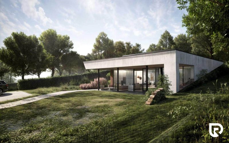 A family house in Častkovce surrounded by greenery, with a terrace and a glass facade.