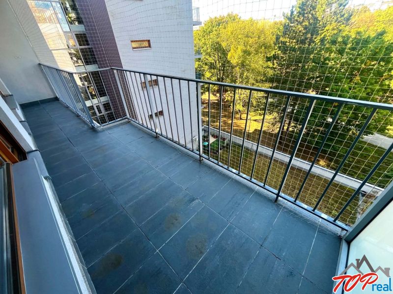 Balcony in a 3-room apartment on Obrody Street, Košice - West district, with a view of greenery.