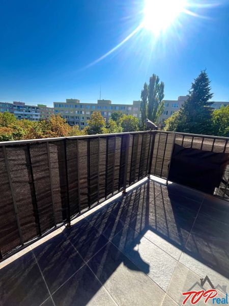 Balcony of a 3-room apartment with a view of greenery on Obrody Street, Košice - West district.
