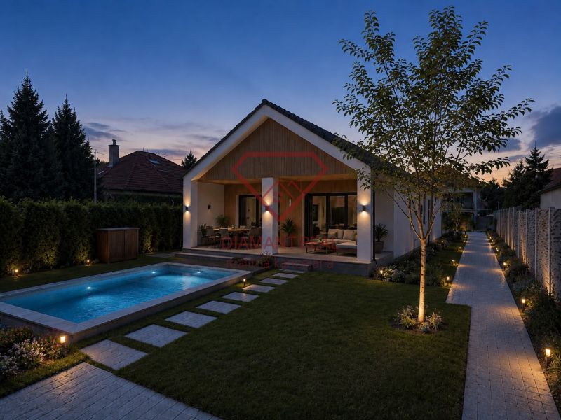 A family house in Veľká Mača in Veľká Mača with a pool at sunset.