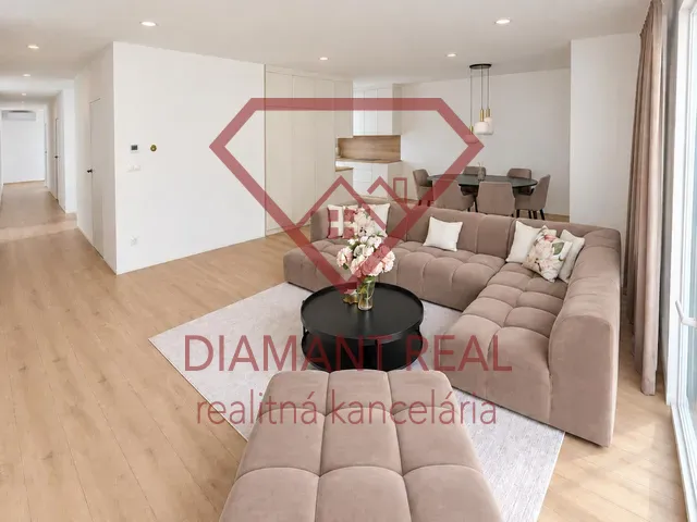 Living room in a family house with a wooden decor floor and a comfortable sofa.