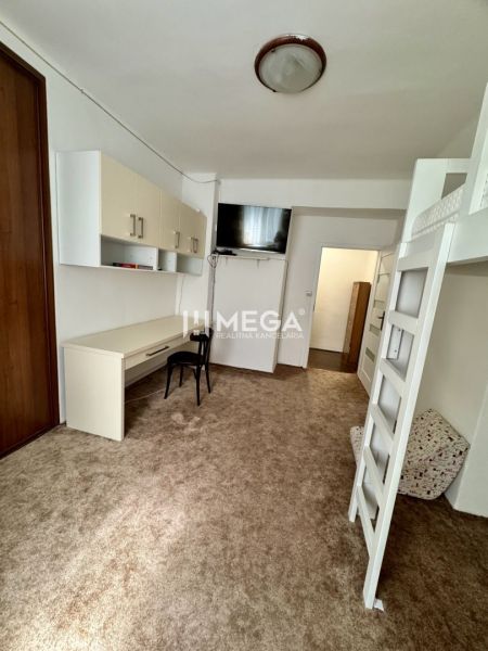 A room with a desk and a bunk bed in a 3-room apartment.