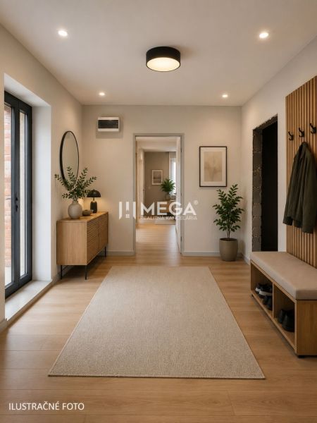 Entrance hall of a family house with a wooden decor floor, plants, and modern lighting.