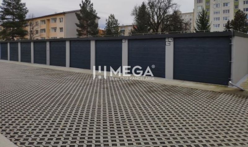 Garages on Laborecká Street in Humenné with a reinforced parking area and surrounding vegetation.