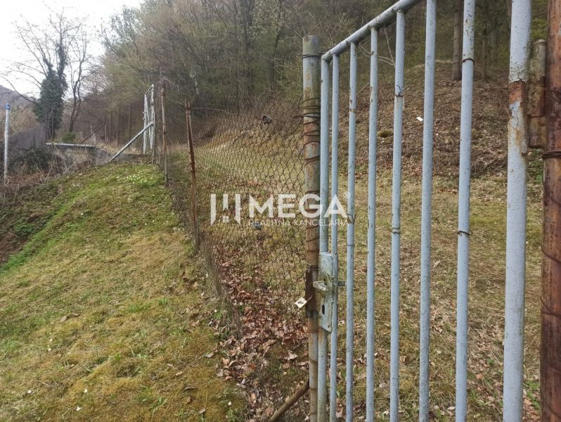 The gate and fence in the garden on the edge of the grove in Humenné on Záhrady Street.