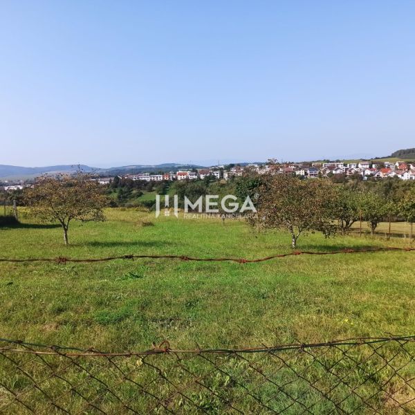 Residential land in Humenné, with a view of the city skyline and greenery.