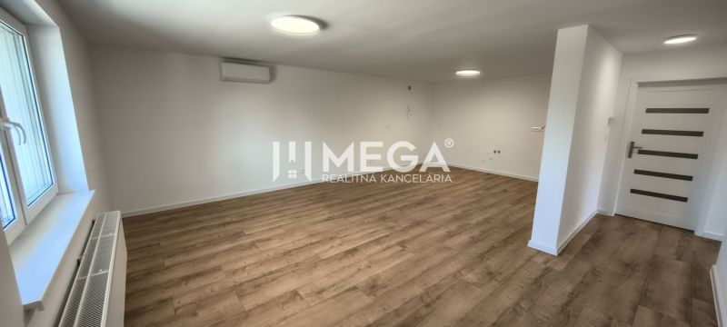 Interior of a 4-room apartment with a wooden decor floor and white walls.