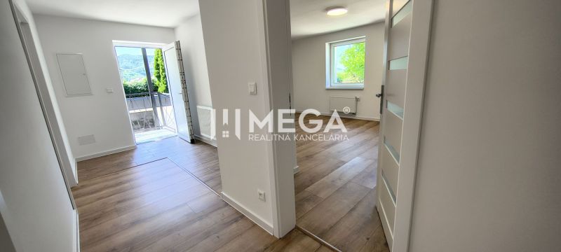 A hallway in a 4-room apartment with a wooden decor floor and lighting.