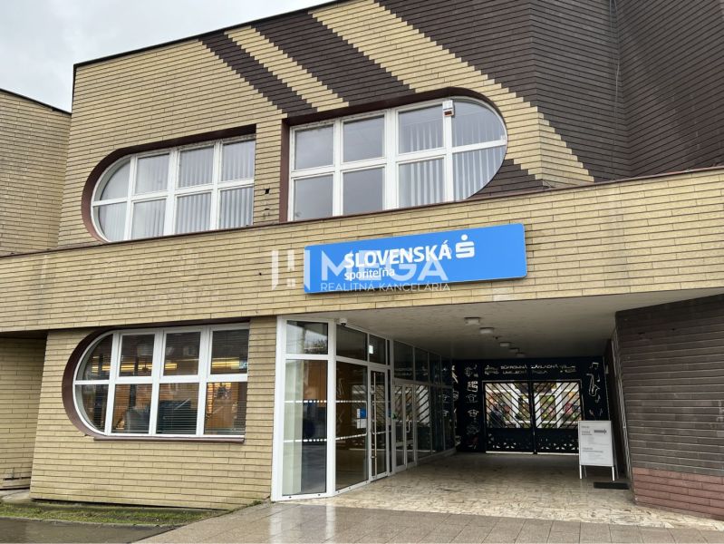 The exterior of the offices on Main Street in Stropkov with dominant rounded windows.