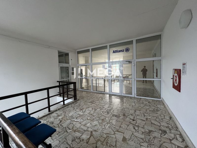 Offices with stone flooring and glass doors, equipped and feeling spacious.