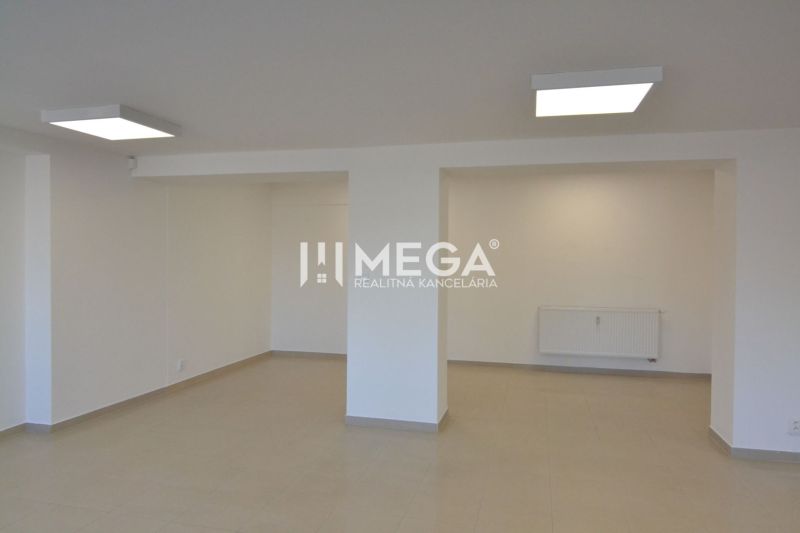 Commercial spaces with white walls and light flooring with a wood decor.