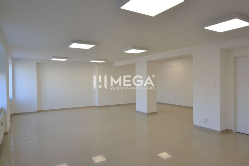 Bright commercial spaces with ceramic flooring and ceiling lighting in Humenné.