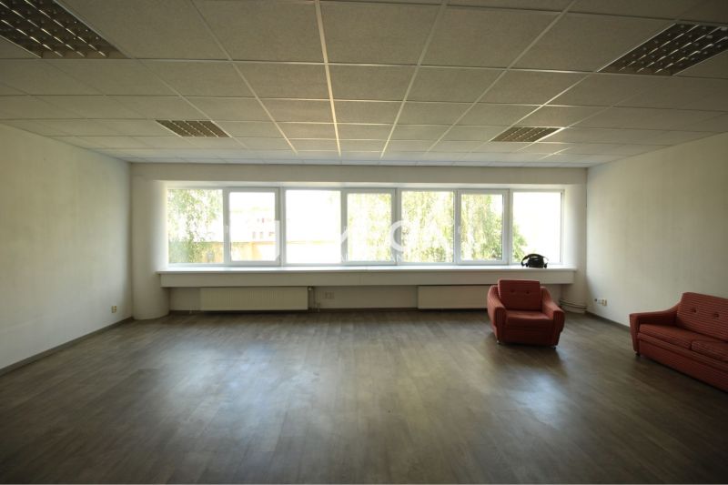 Offices with wood-patterned flooring and red chairs.