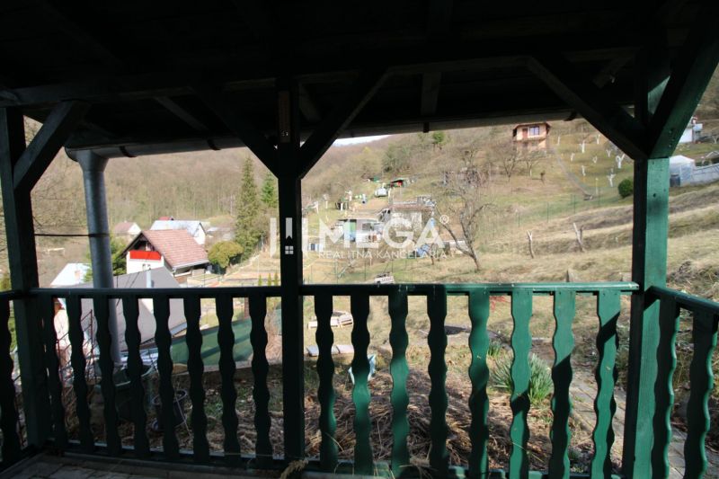View from the garden in ZO Poniklec, Humenné, with rural houses and nature.