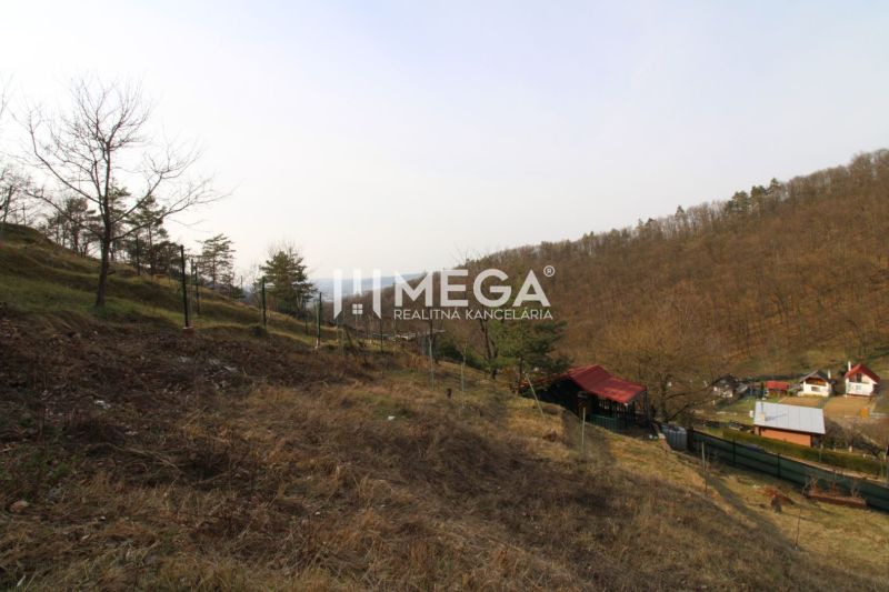 Gardens in the ZO Poniklec area, Humenné, with grassy slopes and small houses in the valley.