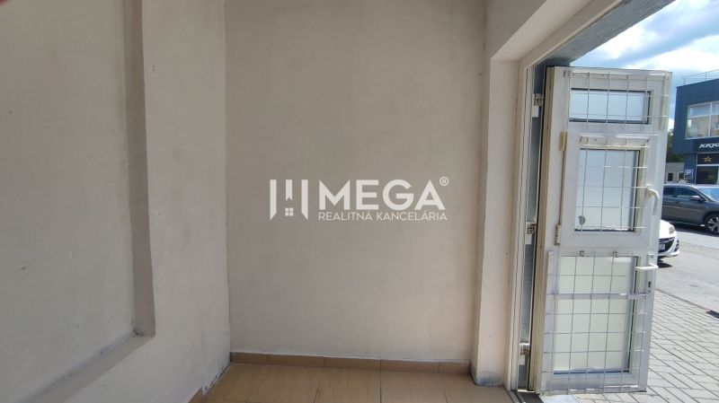 Commercial premises with a wooden decor floor and an exterior view of Osloboditeľov Street in Humenné.