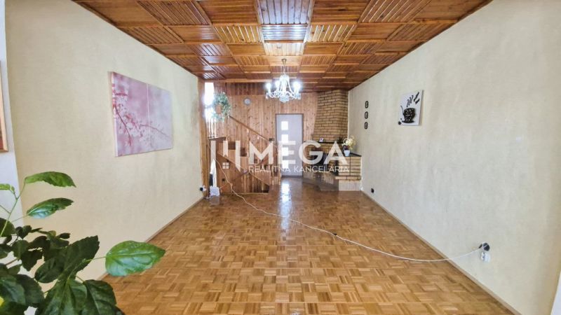 Interior of a family house with a wooden decor floor and a wooden ceiling.