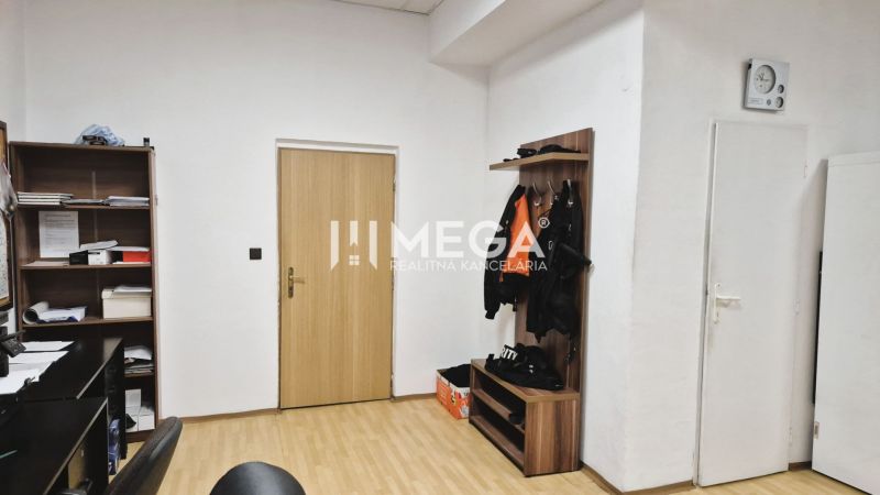 Offices with a shelf, a hanger, and a floor with a wooden decor.