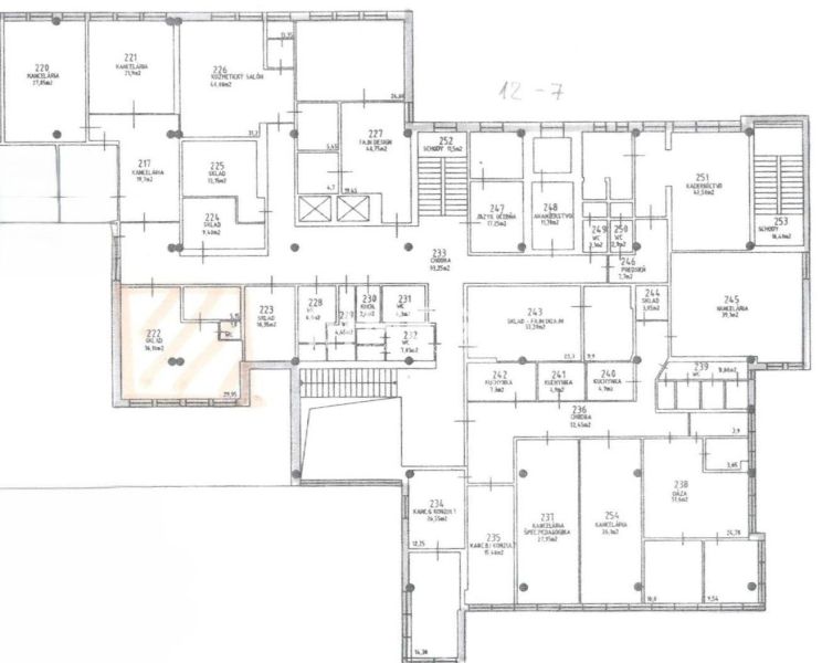 Floor plan of offices with arranged rooms and storage areas.