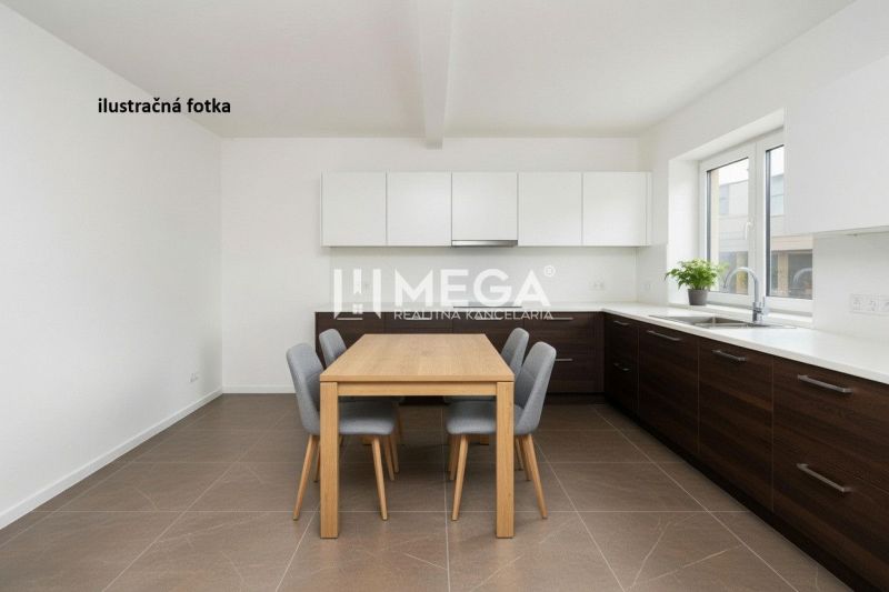 Kitchen commercial space with wood-patterned flooring and white cabinets.