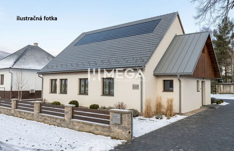 A house with a sloped roof and wooden cladding in winter Zboj, commercial premises.