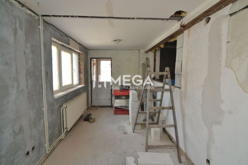 Production facilities with incomplete reconstruction, ladder and blocks, floor with wooden decor.