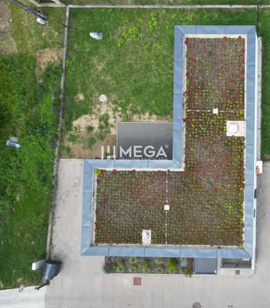 A family house on Gaštanová Street in Humenné with a green roof and a yard.