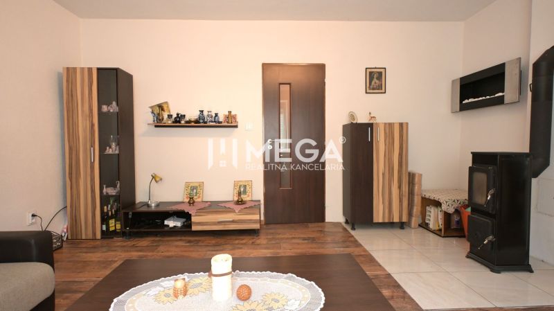 Living room in a family house with designer furniture and wooden decor flooring.