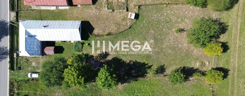Aerial view of a family house in Kolbasov surrounded by a garden and greenery.