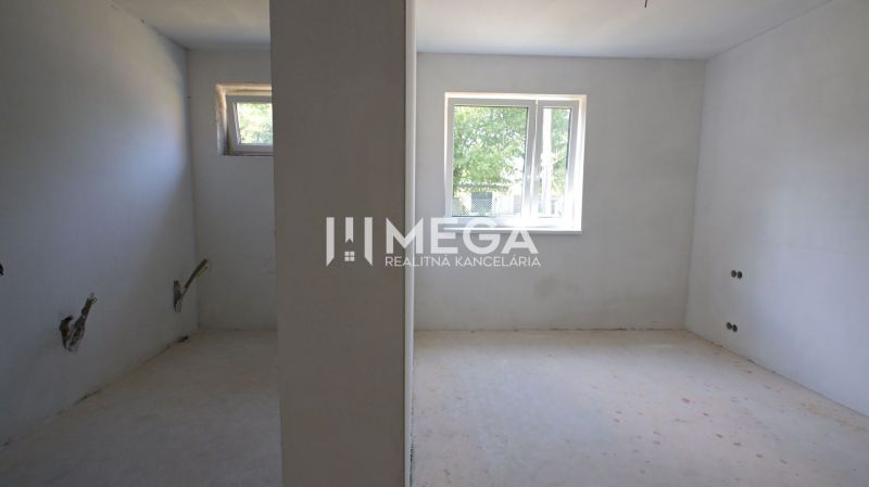 Empty rooms with windows and openings for installations in a family house.