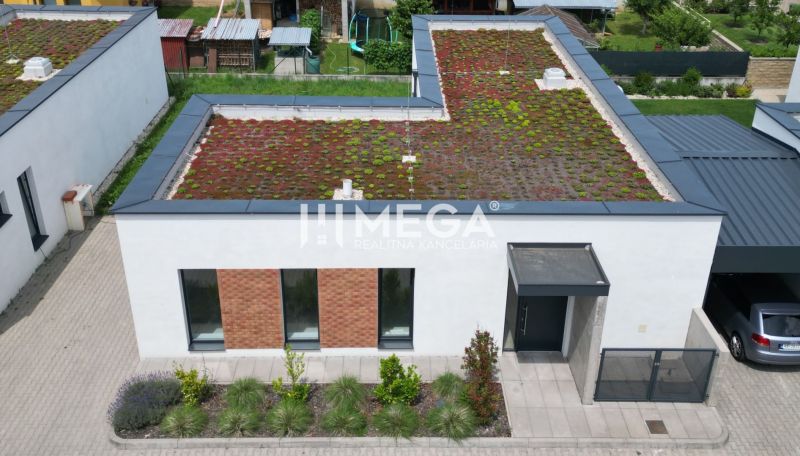 A family house on Gaštanová Street in Humenné with an extensive green roof and a parking space.