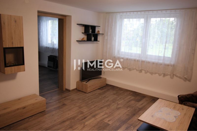 Living room in a family house with a wooden decor floor and furniture.