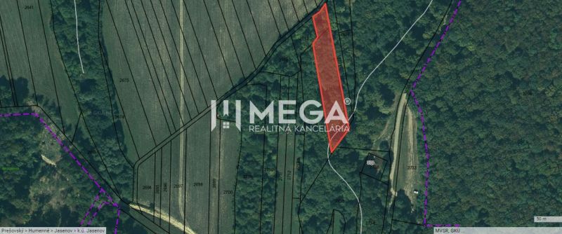 Aerial view of a plot surrounded by fields and forests in Jasenov on Jasenov Street.