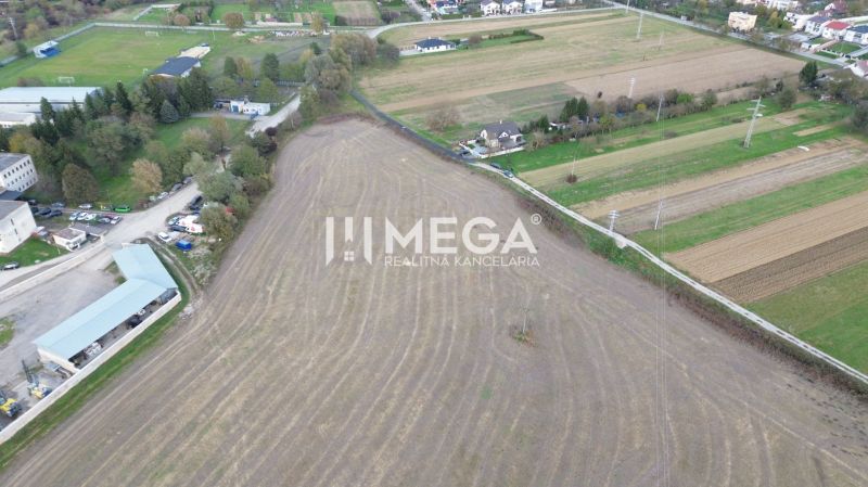 Field in Jasena on Jasena Street with peculiar properties and nearby buildings.