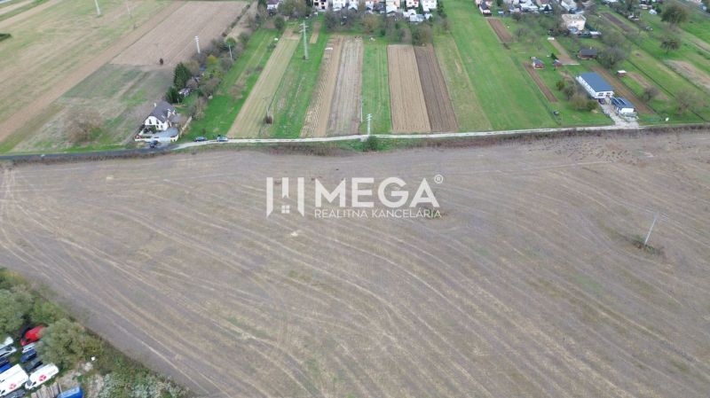 Agricultural landscape in Jasenov with a view of the village and peculiar properties.