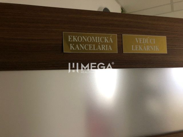 Wooden decor on the door with nameplates Economic Office and Chief Pharmacist.