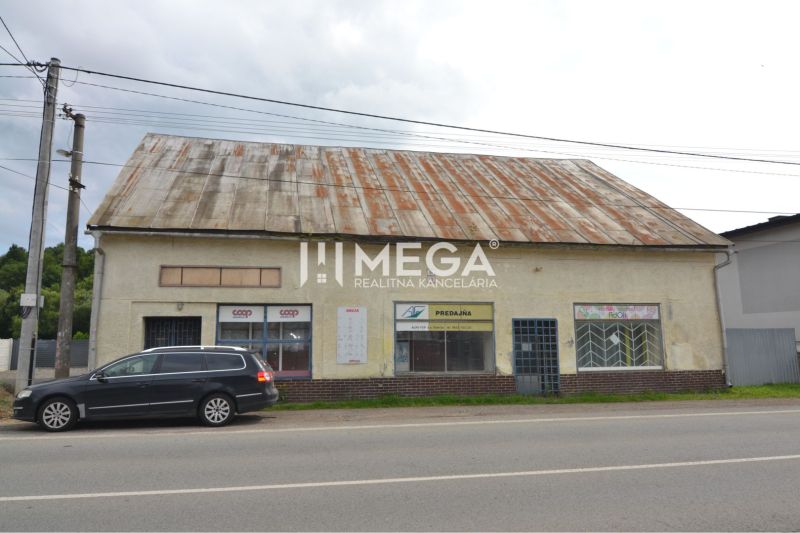 Commercial premises in Stakčín on Mieru Street with a damaged roof and a parked car.