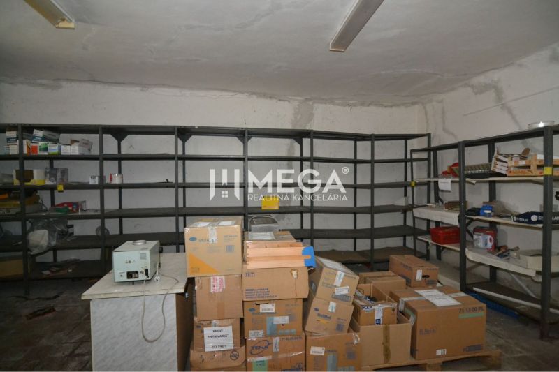 Warehouse commercial space with shelves and boxes.