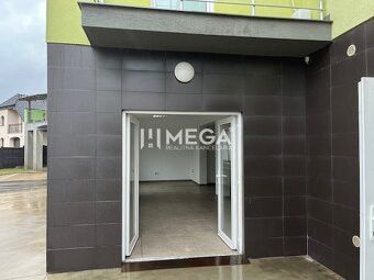 Commercial premises on Komenského Street in Snina with open entrance doors.