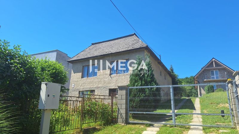A family house on Jesenského Street in Snina, with a garden and fencing.