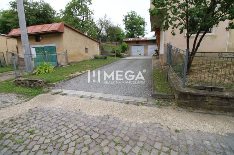 Exterior of a 5 or more room apartment on Gagarinova Street in Snina, with a garage and driveway.