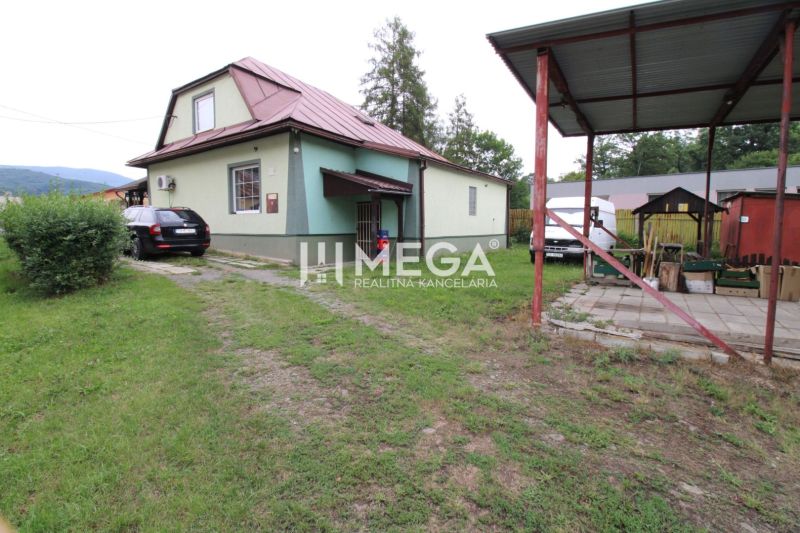 Family house on Ulič Street 131, with a garden, a car, and a shelter.