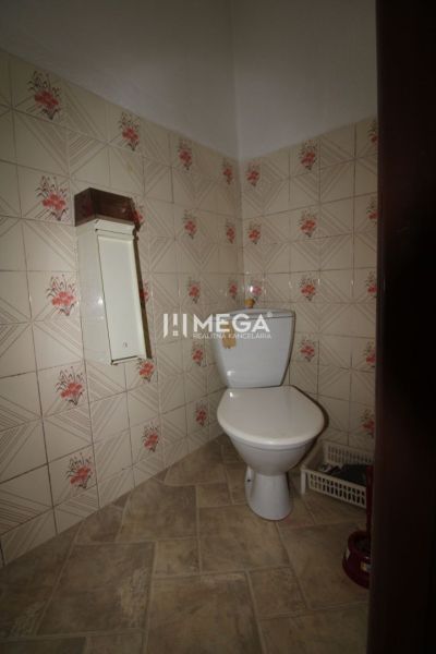 A bathroom with floral patterned tiles in a family house.