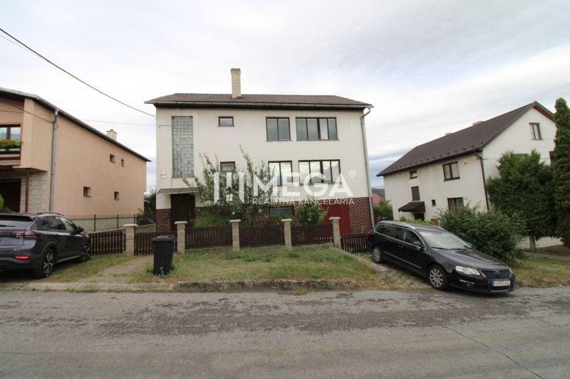 A family house in Snina on Snina Street with a garden and parking in front of the house.