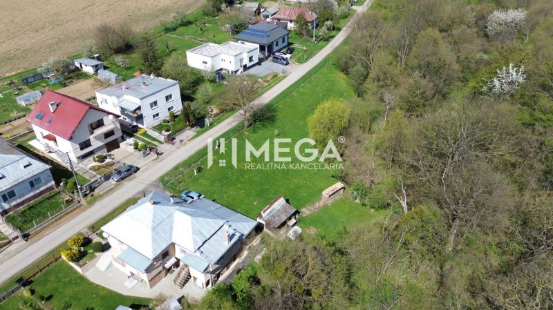 Aerial view of houses on a quiet street with residential plots in Staré.