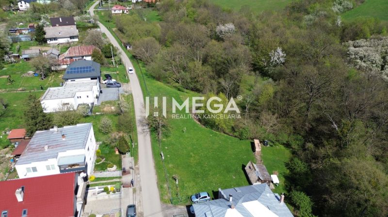 Plots - housing on Old Roads in Staré, surrounded by greenery and houses.